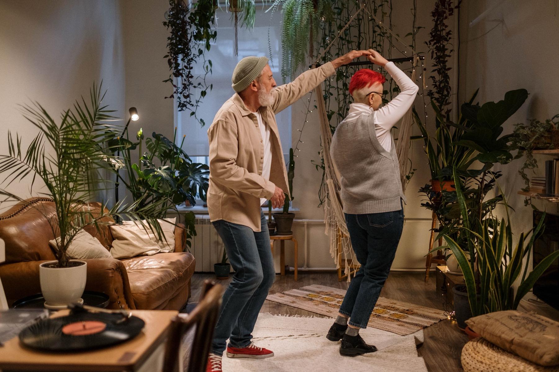 Older adults sharing a warm recreational moment in a cozy room